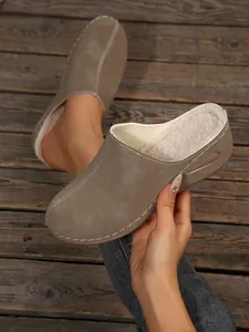 Detailed view of women's taupe platform mule slippers featuring warm faux fur lining