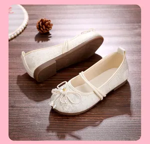Detailed view of elegant cream lace mesh Hanfu flats featuring floral and pearl decorations
