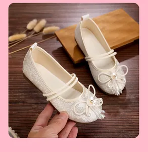 Detailed view of breathable mesh Hanfu flats with elegant pearl and flower accents