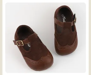 Close-up of brown suede infant Mary Jane shoes featuring a soft non-slip sole and T-strap