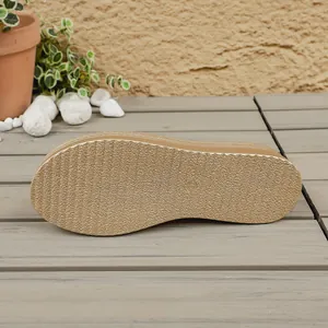 Detailed bottom view of gold platform slipper with textured non-slip sole and size 37