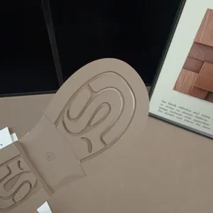 Macro view showing the detailed anti-slip pattern on a child's retro leather shoe sole