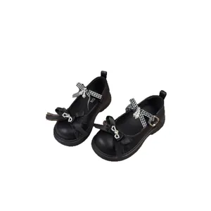 Elegant black girl's princess shoes with retro bows, rhinestones and pearl details