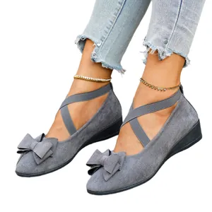 Grey suede-like wedge flats for women featuring bow detail and criss-cross elastic straps
