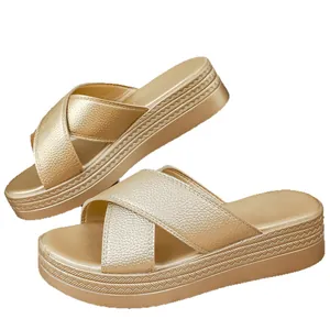Elegant gold platform wedge sandals featuring criss-cross textured straps for women