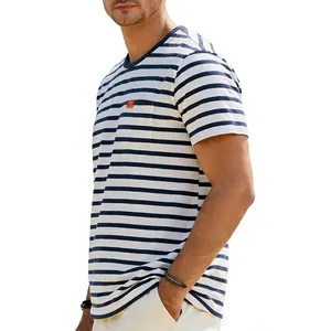 Close-up of men's navy striped t-shirt featuring a chest pocket detail.