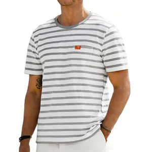 Detailed view of men's oversized grey and white horizontal striped crew neck t-shirt.