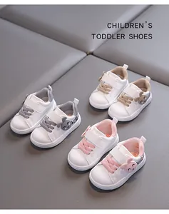 Toddler walking shoes in pink, grey, and tan colors with cute animal decor