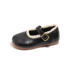 Classic black girls' Mary Jane leather shoes featuring cream lace trim and a decorative gold buckle
