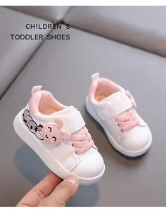 Detailed view of white and pink toddler walking shoes with soft sole and cute rabbit