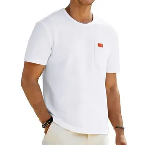 Close-up of men's white oversized t-shirt featuring a practical chest pocket detail