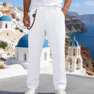 Men's loose white linen straight-leg trousers for summer beach vacation style.