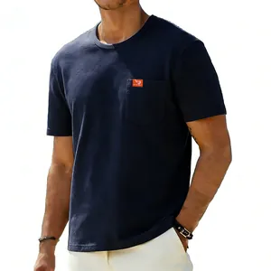 Close-up of navy blue oversized cotton T-shirt with pocket and orange label detail
