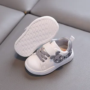 White and grey toddler walking shoes with soft anti-slip soles and a cute cartoon rabbit