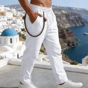 Side view of men's loose white linen straight pants with decorative rope belt