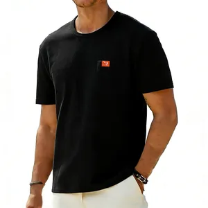 Detail of black cotton t-shirt featuring a chest pocket and minimalist crew neck design.
