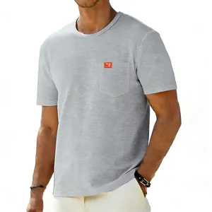 Close-up of a grey oversized cotton t-shirt featuring a practical chest pocket detail.