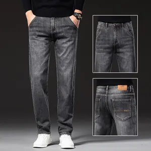 Detailed macro views of men's gray washed straight-leg denim jeans with back pocket detail.