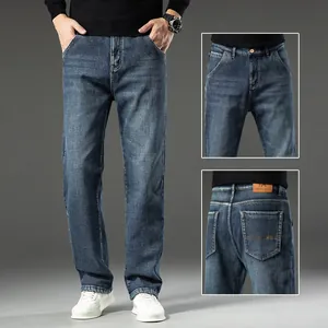 Men's loose straight fit denim jeans with washed finish, front and back pocket details