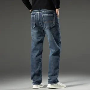 Back view of men's loose straight-leg blue jeans featuring classic pocket embroidery detail