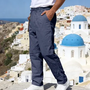 Men's loose linen casual straight pants with drawstring waist shown in outdoor setting.