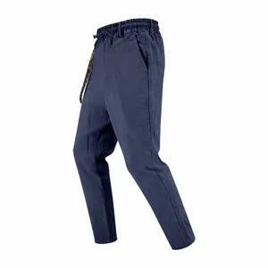 Detail view of navy blue loose linen casual pants for men featuring an elastic drawstring waist.