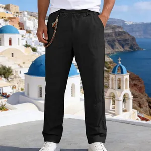 Detail of men's loose black linen casual straight-leg pants with drawstring waist