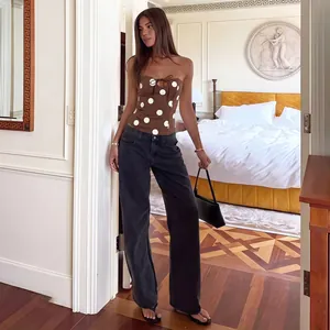 Elegant brown strapless tube top featuring bold white polka dots and front tie-up hollow detail