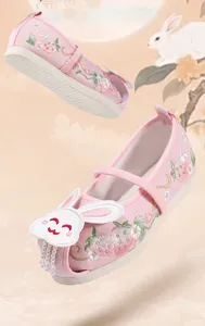 Detailed view of pink Hanfu embroidered shoes for girls featuring cute bunny motifs and pearls