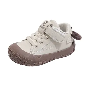 Comfortable beige toddler soft-sole walking shoes featuring a cute cartoon heel detail