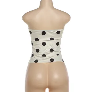 Detailed back view of a stylish cream polka dot tube top featuring a slim fit cut