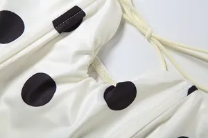 Close-up detail of sexy polka dot pattern and tie-up straps on slim fit tube top