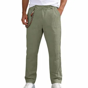 Detail view of men's loose olive green linen casual trousers with drawstring waist