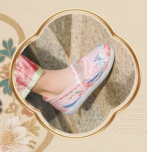 Side detail of girls' pink traditional Hanfu shoe featuring exquisite floral embroidery
