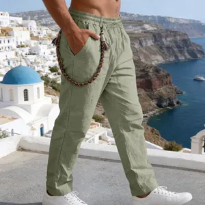 Men's sage green linen casual pants with braided cord detail in side view