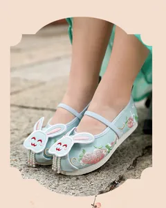 Detailed view of girls' Hanfu embroidered shoes with cute rabbit ear design