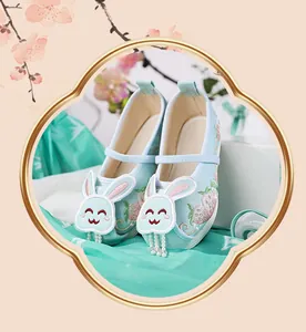 Detailed view of girls Hanfu cloth shoes featuring cute rabbit embroidery and pearl beads