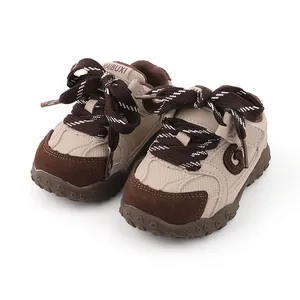 Brown patchwork soft-sole baby walking shoes with large ribbon laces for toddlers