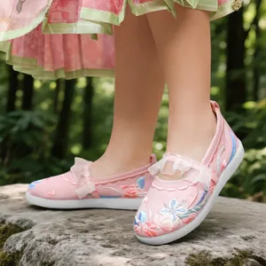 Traditional pink girls' Hanfu embroidered shoes with floral patterns and ruffle details