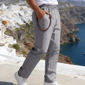 Side view of men's loose grey linen casual straight-leg trousers with braided detail