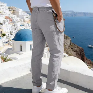 Men's casual grey linen trousers featuring elastic waist and stylish braided accessory