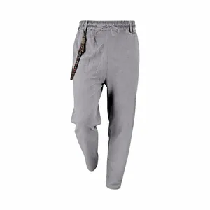 Detail view of grey men's loose linen casual pants featuring an elastic drawstring waist