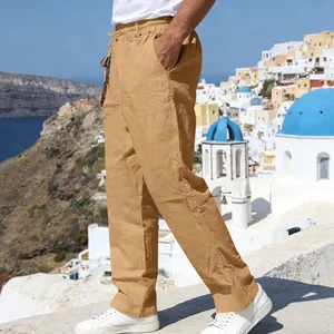 Side view of men's loose khaki linen casual trousers in a scenic outdoor setting