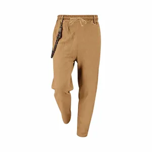 Detailed view of men's loose linen trousers in khaki with elastic drawstring waist