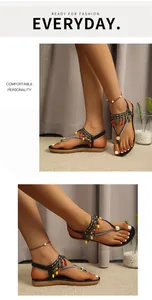 Close-up of bohemian beaded sandals with rhinestone details and elastic back strap