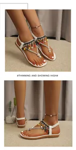 Bohemian flat sandals featuring colorful beads and rhinestone detailing for summer beach wear.