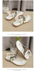 Detail view of Bohemian flat sandals with colorful beads and rhinestone accents