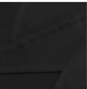 Detailed macro shot showing the high-quality stitching on a black slim-fit mock neck T-shirt