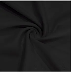 Close-up view of premium black ribbed fabric texture for men's slim-fit T-shirt details