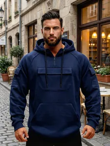 Stylish navy blue men's hoodie featuring multiple pockets and a functional half-zip design